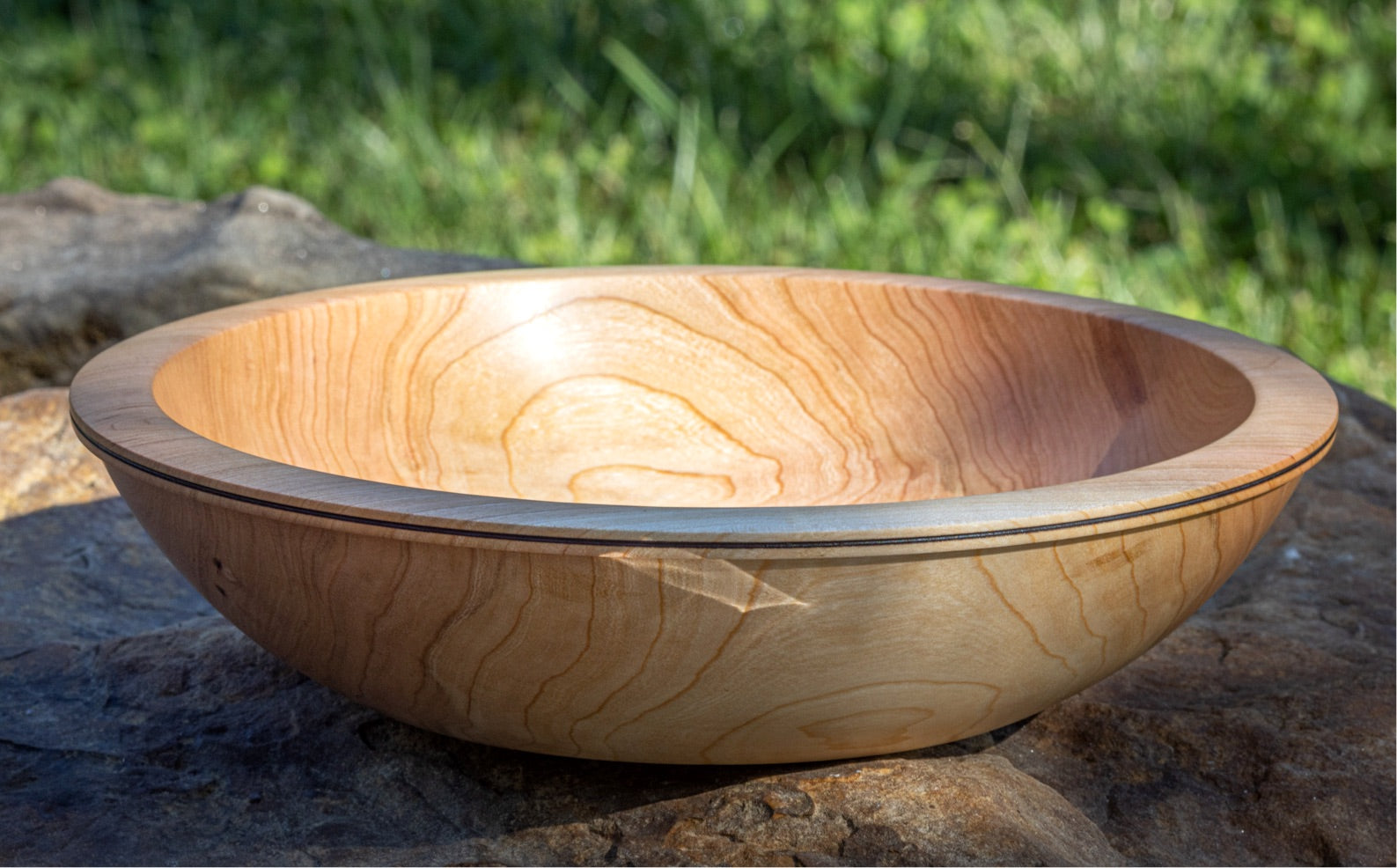 A large handmade wooden bowl made from Black Cherry Wood